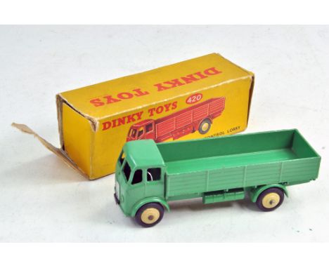 Dinky No. 420 Forward Control Lorry. Green with cream ridged hubs. Generally very good, only minor spots of wear in fair box.