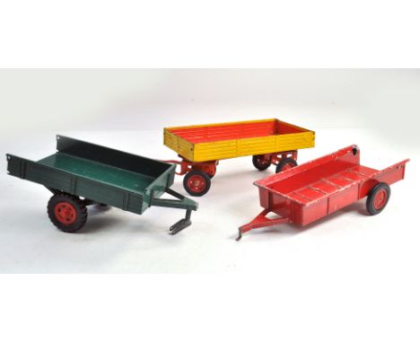 Duo of German Made larger scale trailers plus remnants of Ertl Manure Spreader. Playworn. Condition Reports: Please contact u