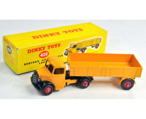 Dinky No. 409 Bedford Articulated Lorry in yellow, black with red hubs. Appears to be a fine example, excellent contained in 