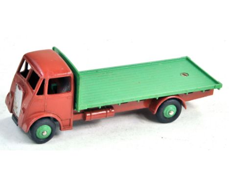 Dinky 512 Guy (1st Type) Flat Truck with matt brown cab and chassis, mid-green back and ridged hubs with silver trim and tow 