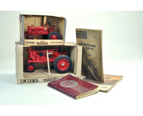 A duo of Ertl boxed tractor issues in 1/16 scale comprising Farmall, plus machinery literature / manuals relating to Caterpil
