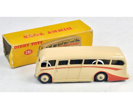 Dinky No. 281 Luxury Coach. Cream - Pale Red/Orange flashes with cream ridged hubs and silver trim. Generally good to very go