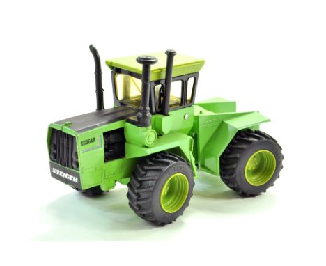Ertl Farm issue comprising 1/32 Steiger Cougar Tractor. Generally good. Condition Reports: Please contact us for additional p