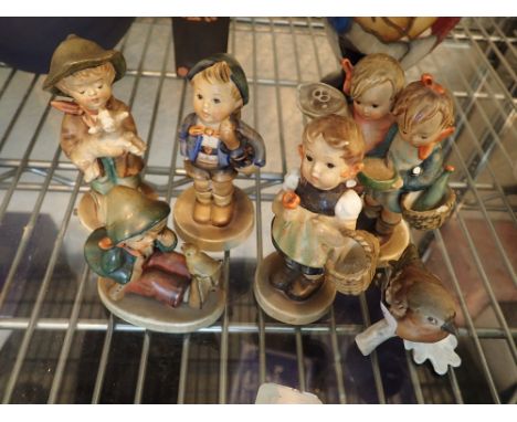 Six Goebel figurines of five children and one bird