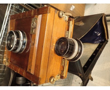 Gandolfi plate camera with spare lens and dark slides, in a leather carry bag   CONDITION REPORT:  Width and height of ground