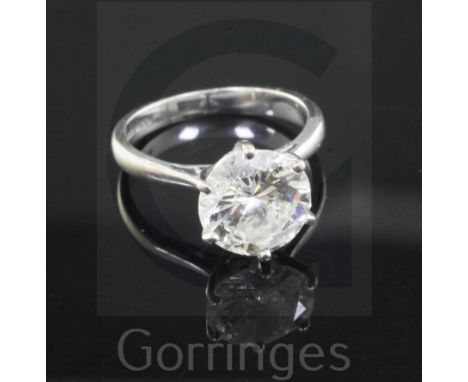 An 18ct white gold and solitaire diamond ring, the round brilliant cut stone approximately just under 3.00cts, size J/K.