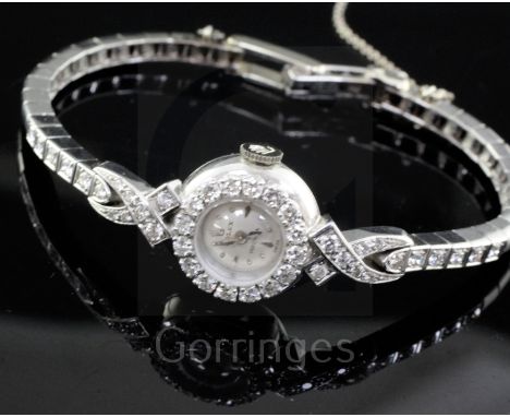 A lady's 18ct white gold and diamond set Rolex Precision manual wind cocktail watch, with diamond set bezel and diamond set p