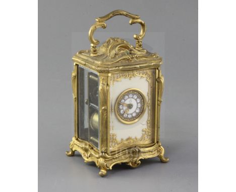 An early 20th century ormolu hour repeating carriage clock, in ornate Louis XVI style asymmetrical scroll case, enamelled Ara