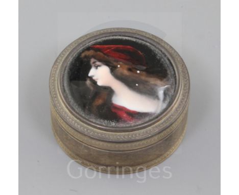 A 19th century French engine turned silver and Limoges enamel circular snuff box and cover, the cover decorated with the bust