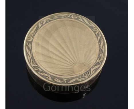 An early 19th century French engine turned 18ct gold circular bonbonniere by Louis Galopin of Geneva, with sunburst decoratio