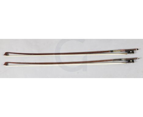 Two violin bows, one silver and the other gold mounted, unstamped, each with an octagonal stick and mother-of-pearl inset ebo