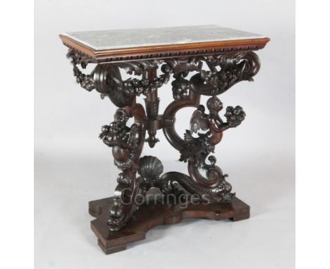 A 17th century style Italian walnut console table, with veined grey marble inset top, the underframe carved with fruiting swa