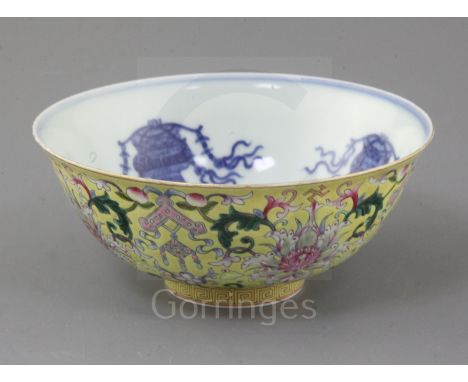 A Chinese yellow ground bowl, Jiaqing six character seal mark and of the period (1796-1820), finely painted with lotus flower