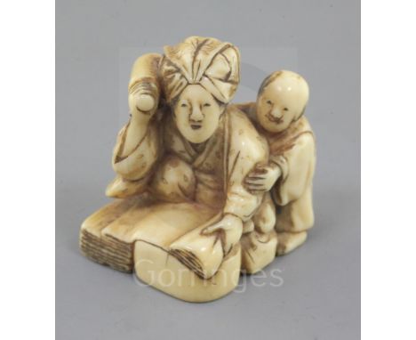 An ivory netsuke of a woman and child, 19th century, kneeling before a large stone, beating cloth, three character signature,