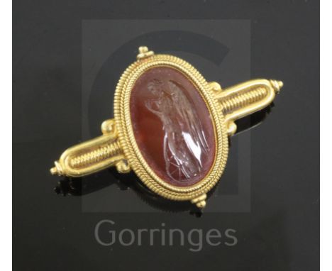 A Victorian Castellani gold and Roman carnelian intaglio archaeological revival style brooch, the oval carnelian carved with 