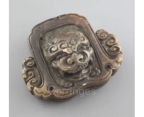 A Japanese stag antler netsuke of a roof tile with head of shishi, mid 19th century, seal mark, w. 4.3cm