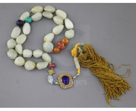 A Chinese pale celadon jade pebble and hardstone necklace, probably Republic period, total drop incl. silk tassle pendant 72.