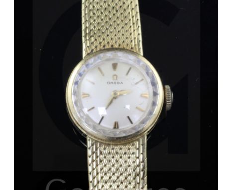A lady's 18ct gold Omega manual wind wrist watch, on integral 18ct gold Omega bracelet.