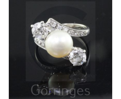 A white gold, natural pearl and two stone diamond crossover ring, with diamond set shoulders and CISGEM certificate dated 201