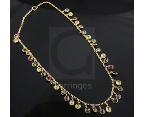 An early-mid 20th century gold and multi-coloured tourmaline drop fringe necklace, set with thirty seven stones, 38cm.