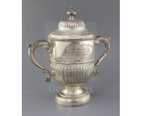 A late Victorian demi-fluted silver two handled pedestal presentation cup and cover, by John Newton Mappin, with engraved ins