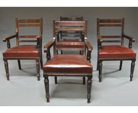 A set of eight Victorian mahogany leather dining chairs, late 19th century, all with arm rests, red leather seats, (8)Over al