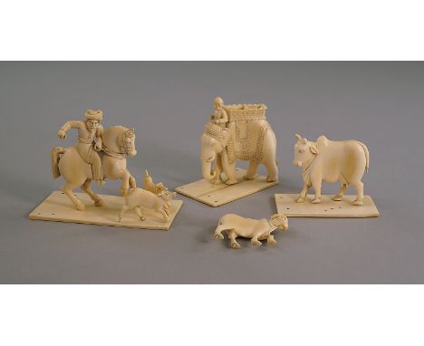 A group of Indian ivory carvings, late 19th/early 20th century, to comprise a pair of humped oxen, an elephant and rider and 