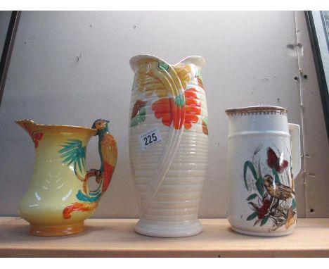 A Burleigh Ware parrot jug, Arthur Wood deco vase and a Booths pottery jug