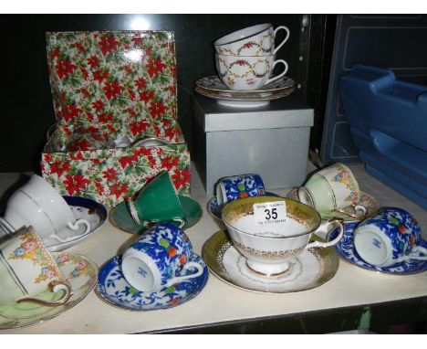 A good lot of cups and saucers including a boxed pair of Royal Worcester cups and saucers