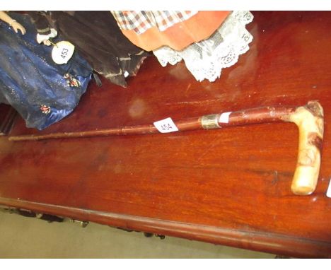 A silver banded walking stick
