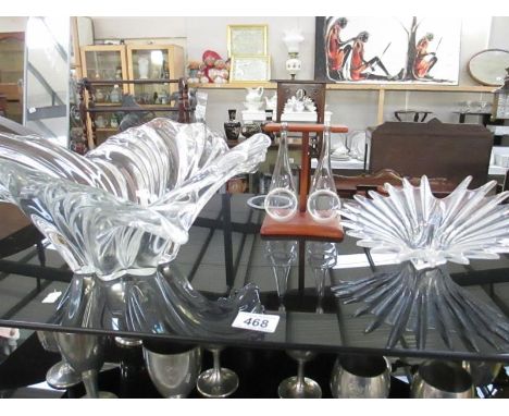 2 art glass bowls and a pair of glass pipes on wooden rack
