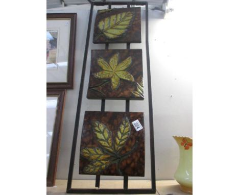 A modern art pressed metal wall plaque
