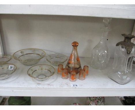 A shelf of vintage glass ware and decanters ****Condition report**** Fair condition with clouding to decanters There are chip