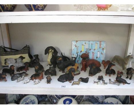 A shelf full of dachshund figures etc.