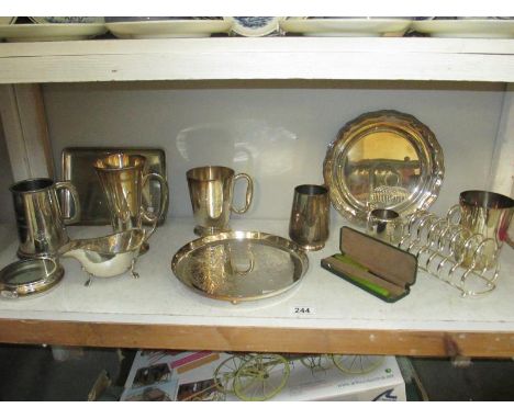 A shelf of silver plate