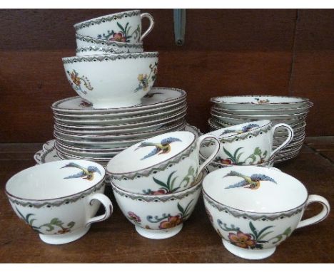 An Aynsley tea set comprising nine cups, twelve saucers, twelve side plates, two sandwich plates and sugar bowl