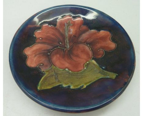 A Moorcroft dish, hibiscus pattern, diameter 11.5cm, marked Julie R.