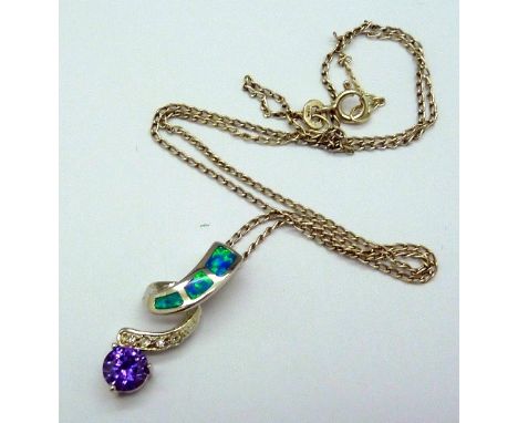 A silver and amethyst pendant and chain