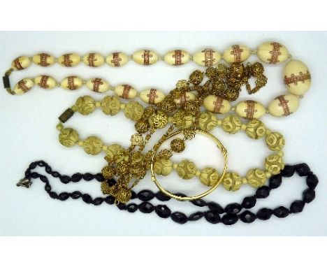 Four necklets and a 9ct gold metal core bangle