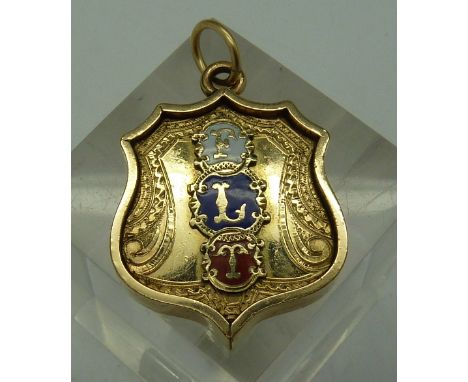 A plated and enamel fob