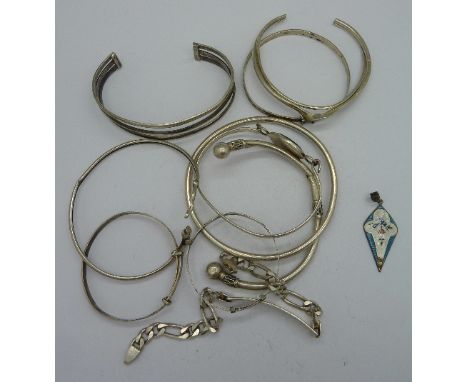 Nine silver bangles, a silver identity bracelet and a silver and enamel pendant, enamel a/f