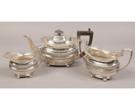 A silver three piece tea set to include teapot, milk jug, twin handle sugar bowl, assayed Chester 1912 by George Nathan &amp;