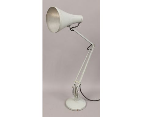 A vintage Herbert Terry anglepoise lamp with circular base. 