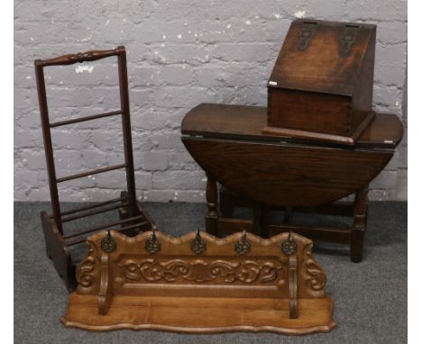 An oak drop leaf occasional table along with a mahogany coal box, oak coat rack and a boot rack. 
