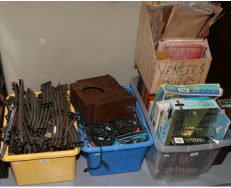 Three boxes of miscellaneous to include four display boxes, jigsaws, fairy lights, C.Ds, wooden mantle clock case, metal rail