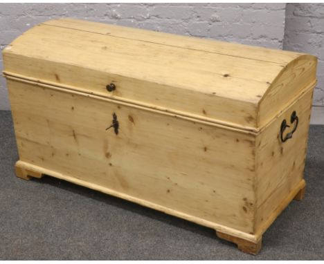 A Victorian stripped pine dome top travel trunk. 