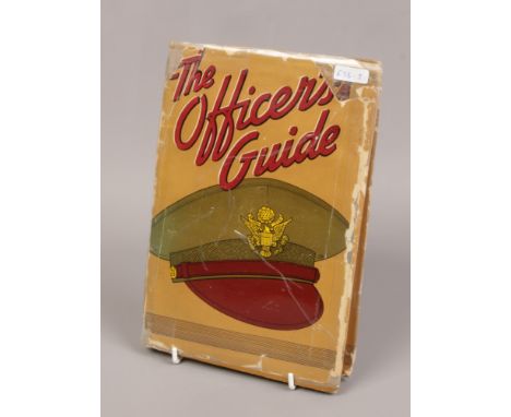 A 1942 World War II hardback The Officer Guide Book signed by Captain Ronald R Jordan. 