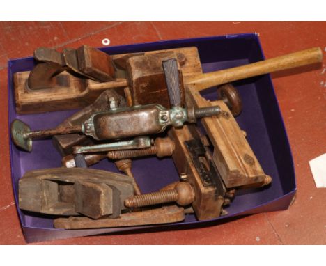 A box of vintage hand tools to include planes, drills, mallet etc. 