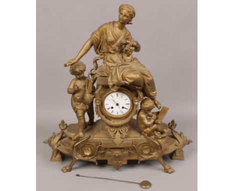 A 19th century French gilt metal mantel clock housing an 8 day japy freres movement striking on a bell with enamel dial and s