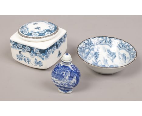 An oriental blue and white bowl, along with a Chinese erotic blue and white snuff bottle and a ceramic blue and white lidded 